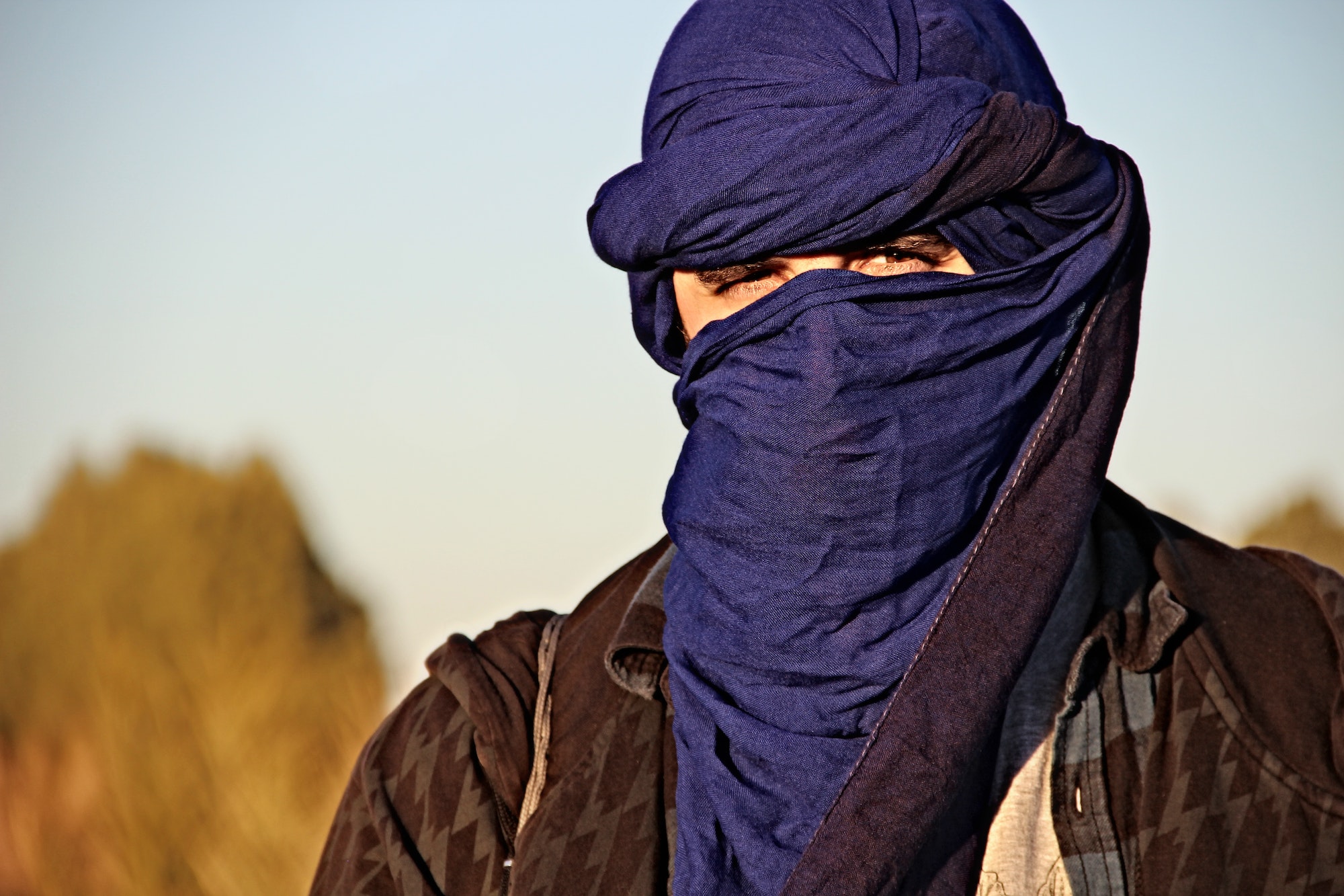 A young man with the Berber scarf in the Merzouga desert